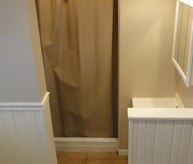 Full bathroom with shower and tub