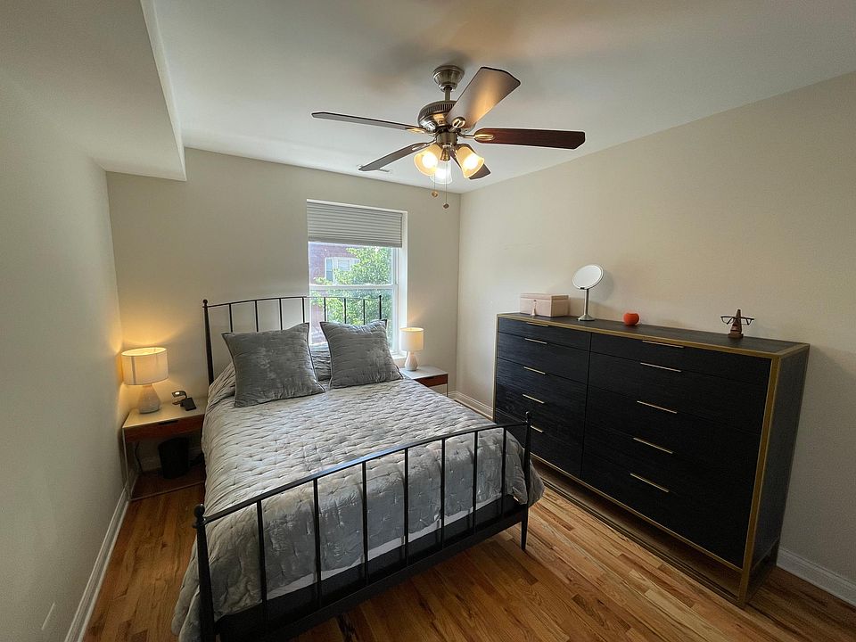 Primary bedroom has east facing window for lots of natural light. Queen size bed in photo.