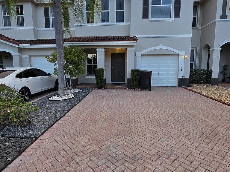 Driveway with enough space to park 4 cars. Hassle free front yard, HOA cleans & trim every Monday.