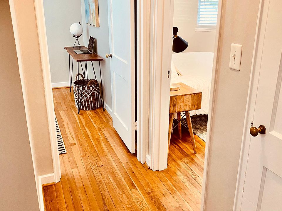 Hallway leading to both bedrooms, hall closet, and bathroom.