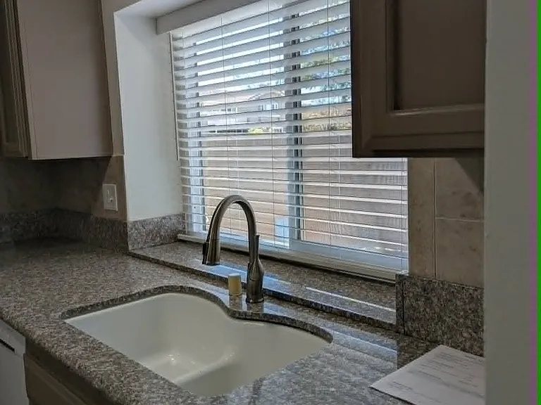 Kitchen sink with window to enclosed patio