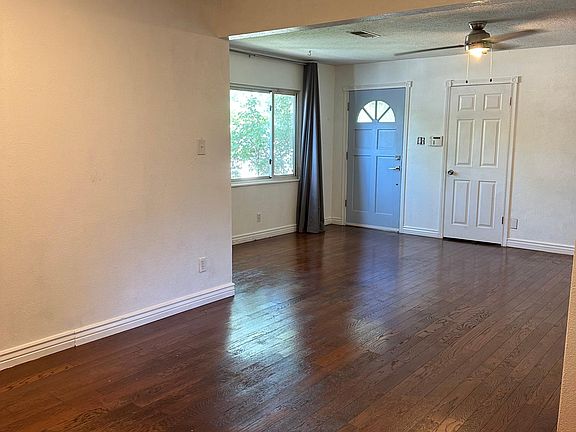 This photo is taken from the dining room looking into the living room and front door