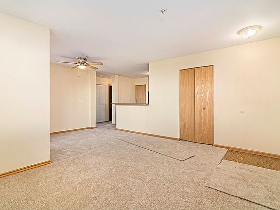 Living Room Brand new carpet, ceiling fans, and hardware throughout.