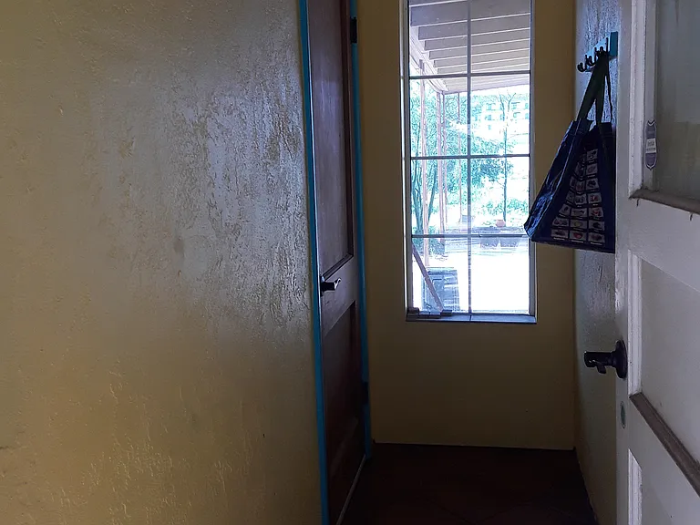 Hallway to carport, laundry and kitchen