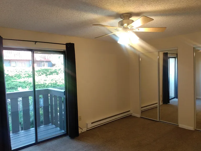 Level 2 bedroom with balcony access and large closet space.