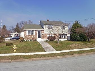 Gorgeous Brick & Vinyl Split level on corner lot
