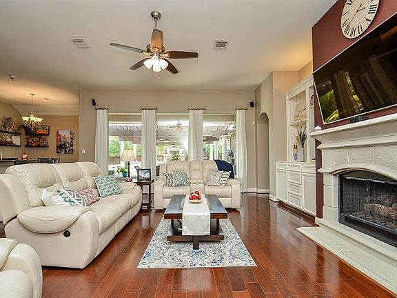 Open concept brings everyone together to enjoy the warmth of the fireplace or the big game.