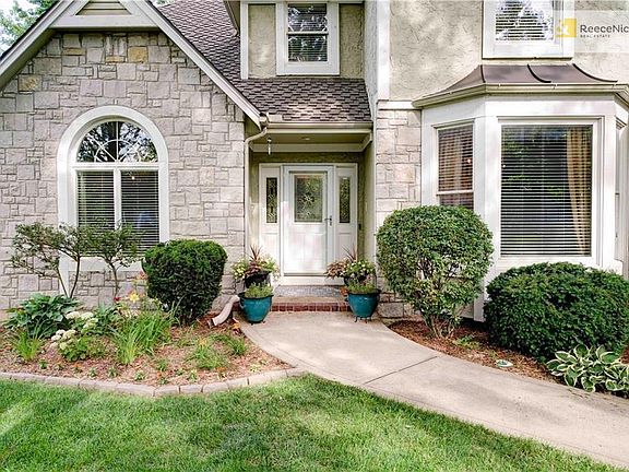 Enjoy all the lush landscaping and stone accents on the home.