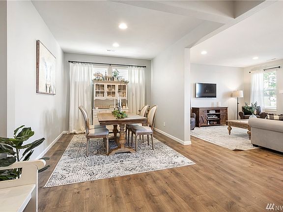 Open and bright the privately situated dining room is perfect for entertaining.