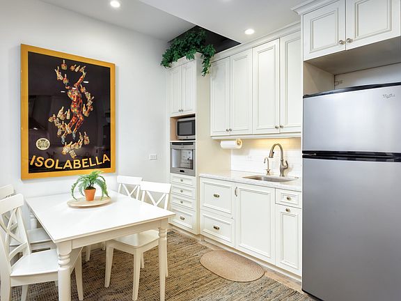 Upstairs Unit: Kitchen and Dining Area