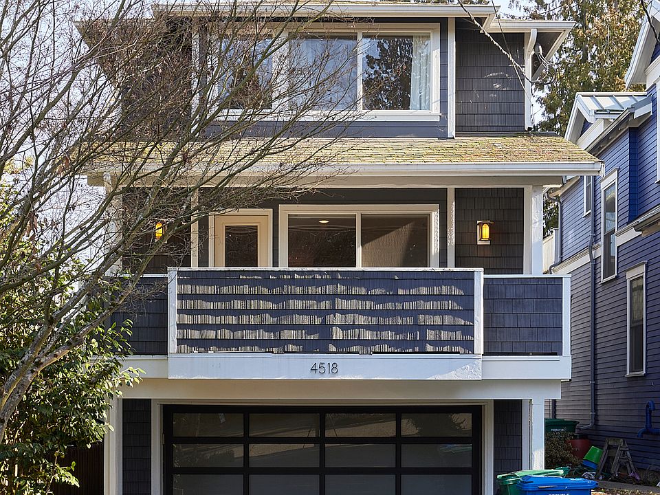 Front of House w/ Large Driveway and Front Deck