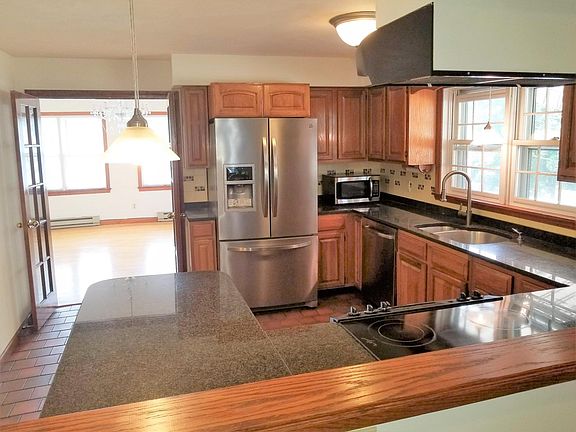 kitchen with dishwasher, stainless appliances, and granite countertops