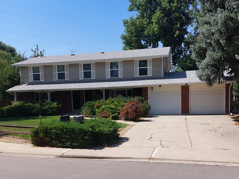 Exterior of duplex. 9765 is closest to garage.