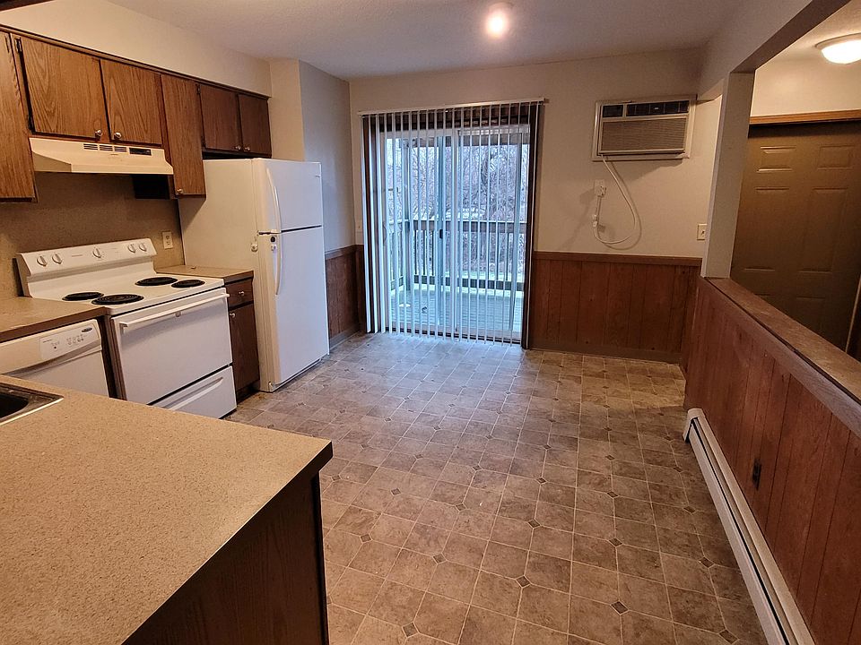 Kitchen w/ slider to private patio and basement access.