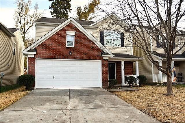 Cozy cottage style house with drive way, two car garage and private backyard fence