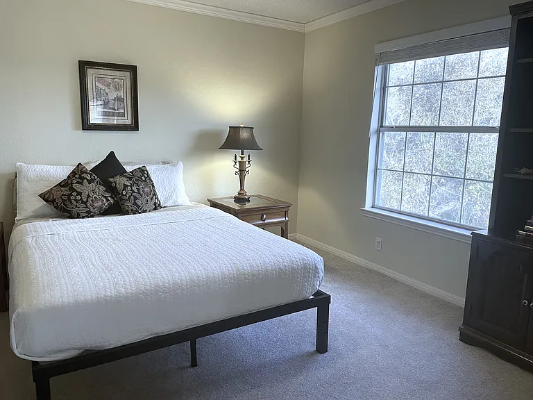 One of five bedrooms, Room with a View features queen sleeping on memory foam mattress, treetop views, drawer storage for clothings