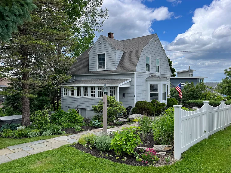 Stunning English garden and a new white picket fence.