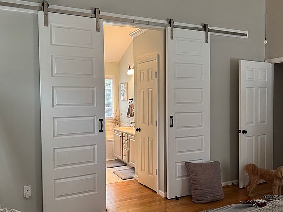 Primary becroom. Barn doors to bathroom