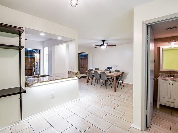 Dining area and entrance to half bath.