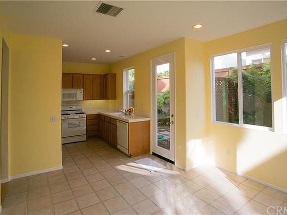 Bright sunny kitchen allows for plenty of sunshine and views of the garden.