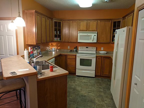 Main floor kitchen with pantry & breakfast bar.