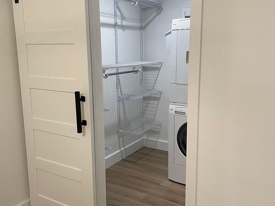 Walk-in closet with WD and shelving system.