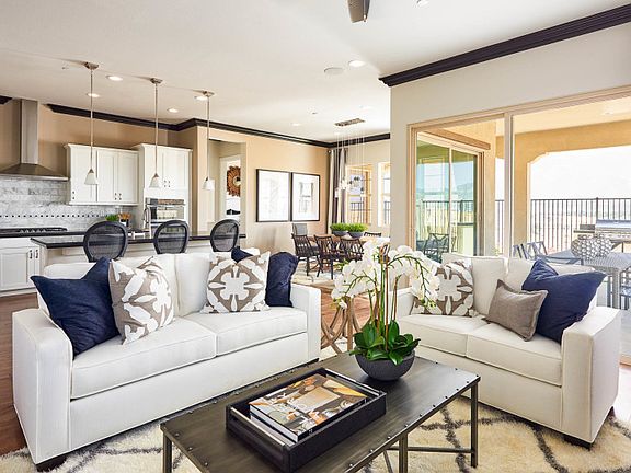 Open gathering room connects the kitchen and cafe for seamless entertaining.