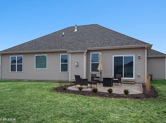 Sliding glass door will lead you to the concrete patio...the perfect place to enjoy a fire or cookou