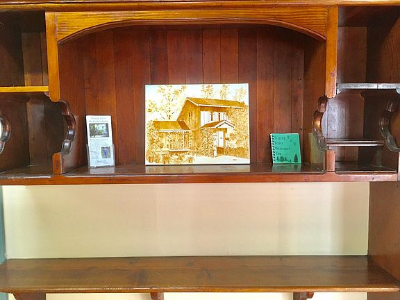 Custom built-in display shelves in the dining area.