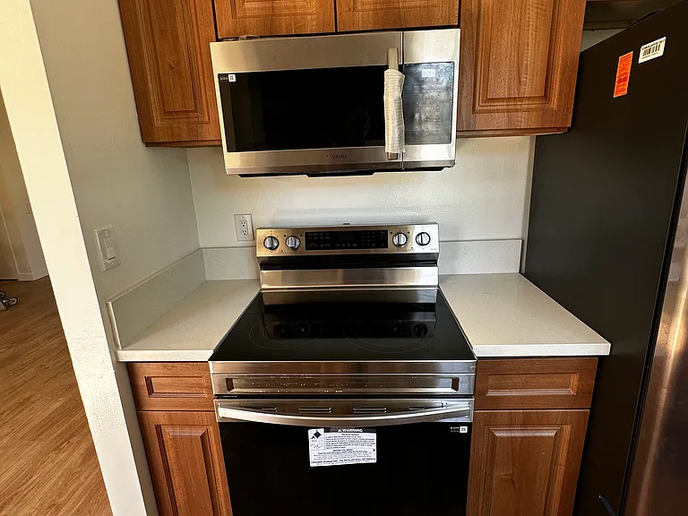 More Kitchen Photos with view of New Floors, Cabinets and Appliances, microwave with exhaust Fan...All APP Accessible/Controllable Stove and Refrigerator