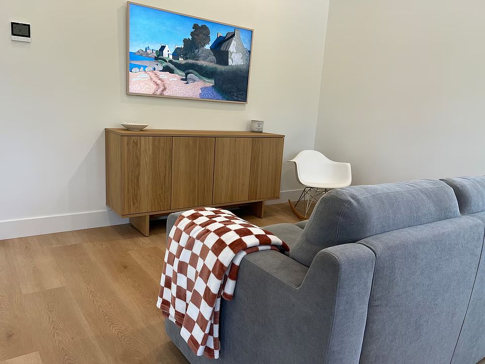 Couch, media cabinet and frame tv