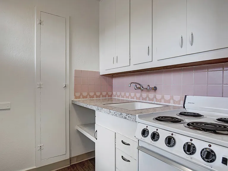 Kitchen with Pink Tile Backsplash