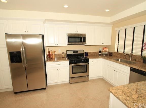 Beautiful brand new kitchen!  All new cabinets, granite counter tops, stainless appliances, tile flooring, recessed lighting, sink, etc!