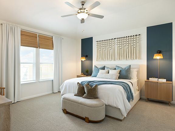 Retreat to the primary bedroom at the end of a long day.