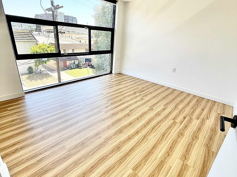 Primary bedroom. Large operable windows with mountain views.