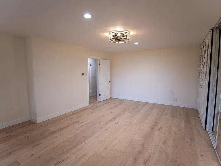 Large primary bedroom with room for sitting area and bedroom set. This bedroom has more storage than you can believe.