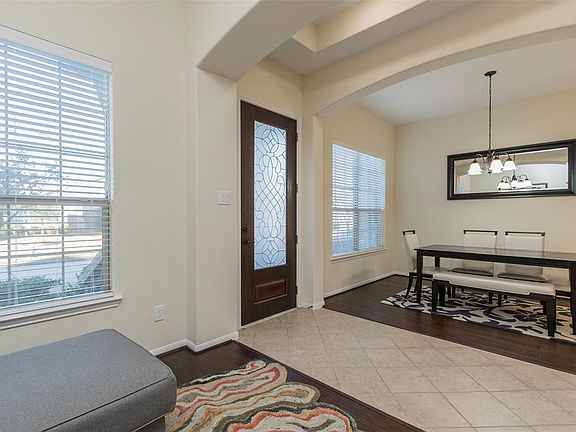 Very inviting, tiled entry with soaring ceiling and tons of natural light.