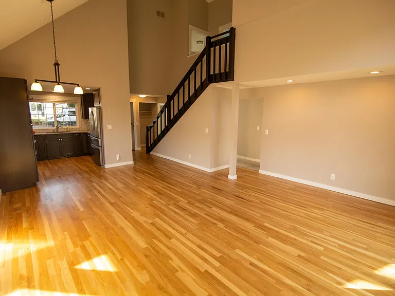 View of the kitchen and living area from the back of the house.