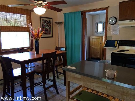 tiled kitchen- dining area leads to sunporch/office room