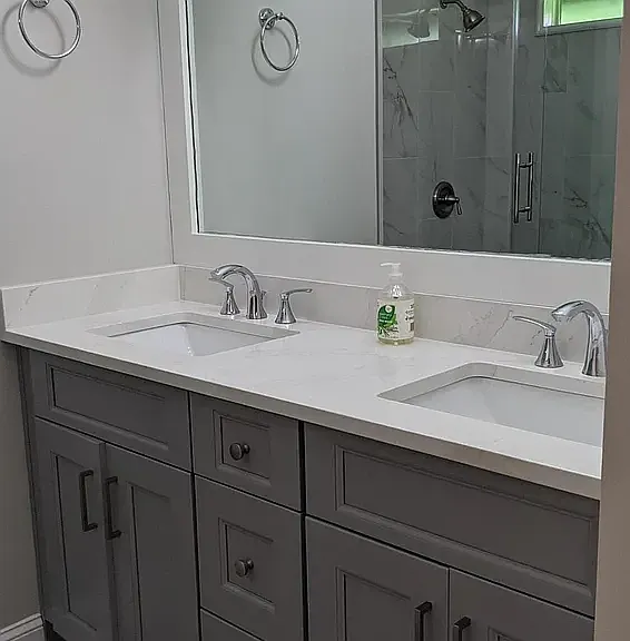 dual vanity with soft close cabinetry in primary ensuite