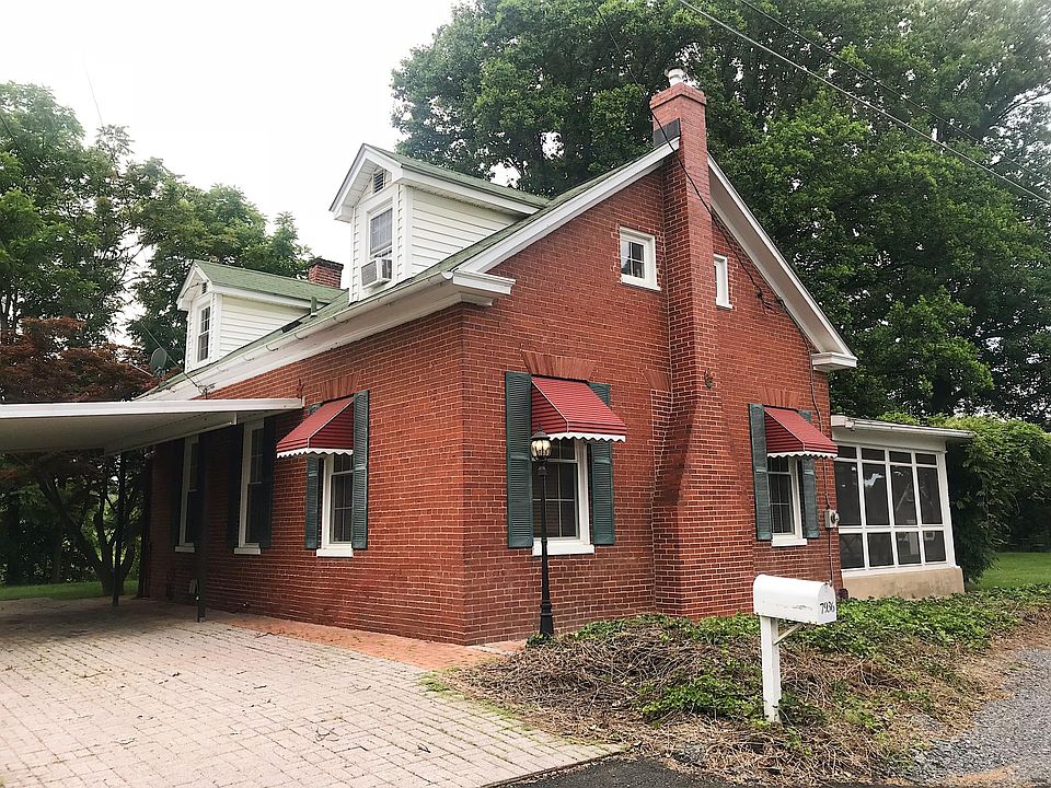 Brick front with carport 