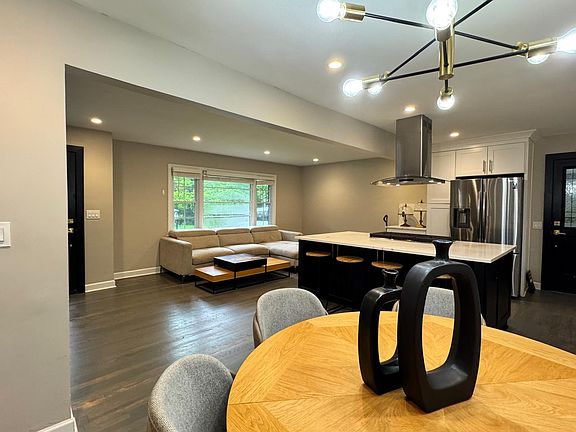 perspective from dining area. You can see the carport door near the fridge