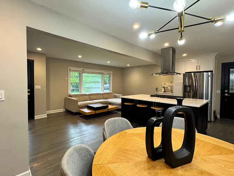 perspective from dining area. You can see the carport door near the fridge