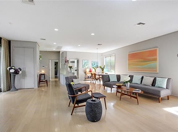 Spacious living room open to dining area.