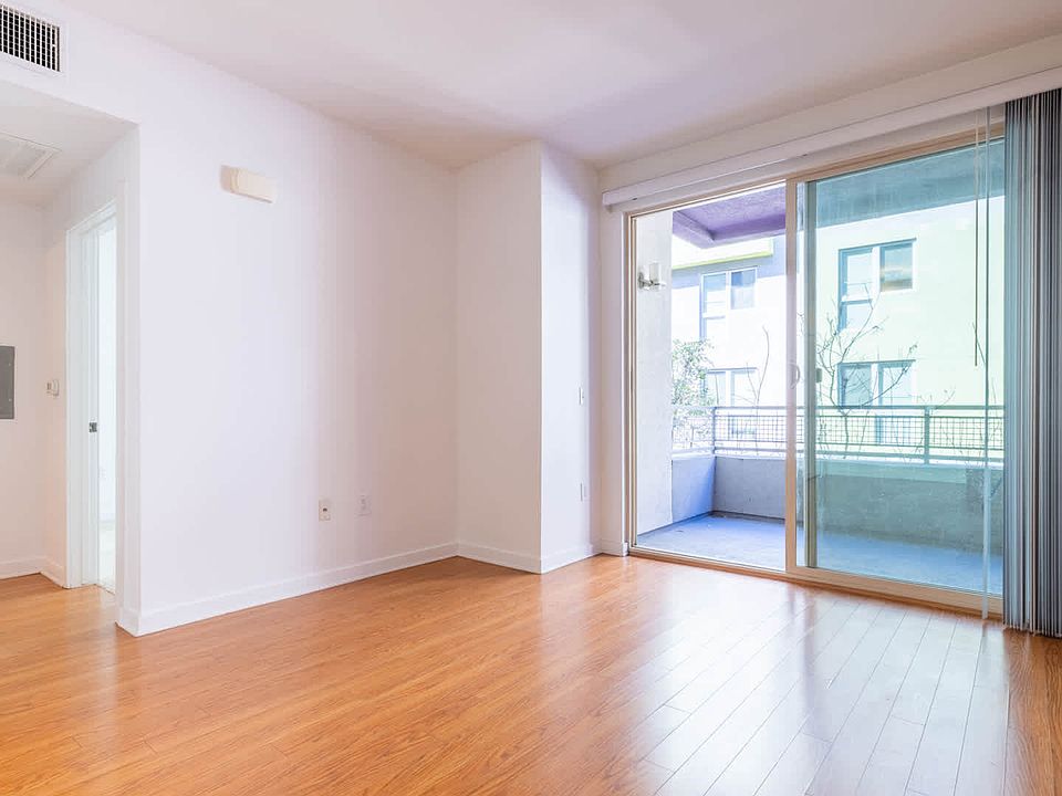 Living Room with Balcony and Hard Surface Flooring