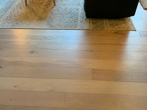 Part of living room. New wide/plank hickory hardwood floor