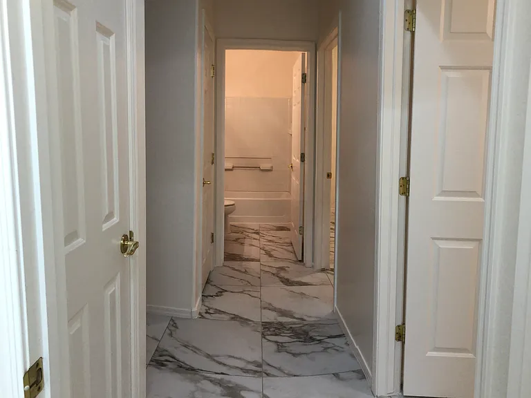 Hallway to Bedrooms 2 & 3 and Second Bath