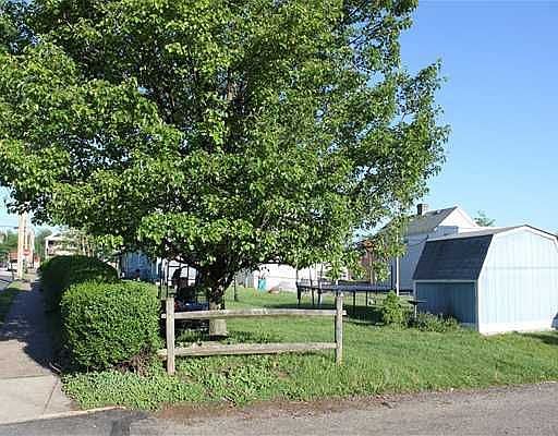 View of rear Alley & Shed.  Mature landscaping.