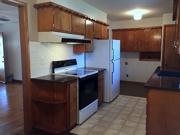 Kitchen with granite counter tops.