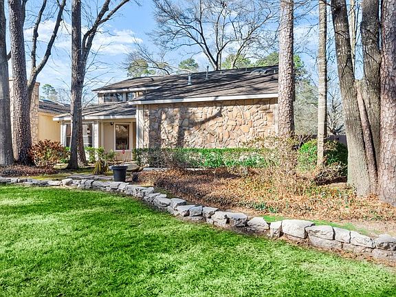 Surrounded by lovely mature shade trees